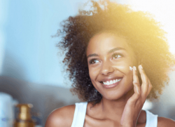 female model using professional skincare for anti-ageing treatment in Inverness
