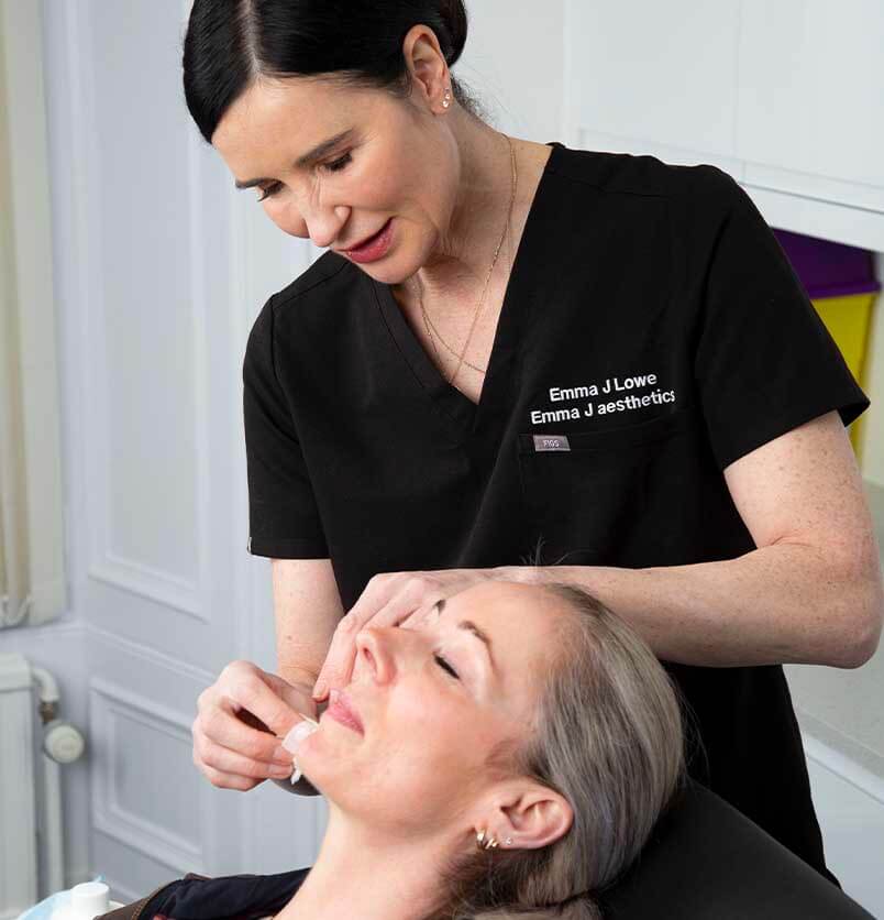 Emma from Emma J Aesthetics in her skin clinic in Inverness giving aesthetics treatment