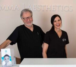 Dr John elder and Emma J in the reception at Emma J aesthetics in Inverness