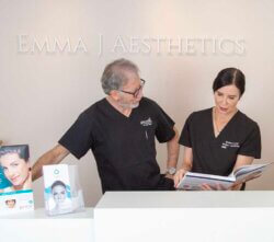 Dr John elder and Emma J in the reception at Emma J aesthetics in Inverness