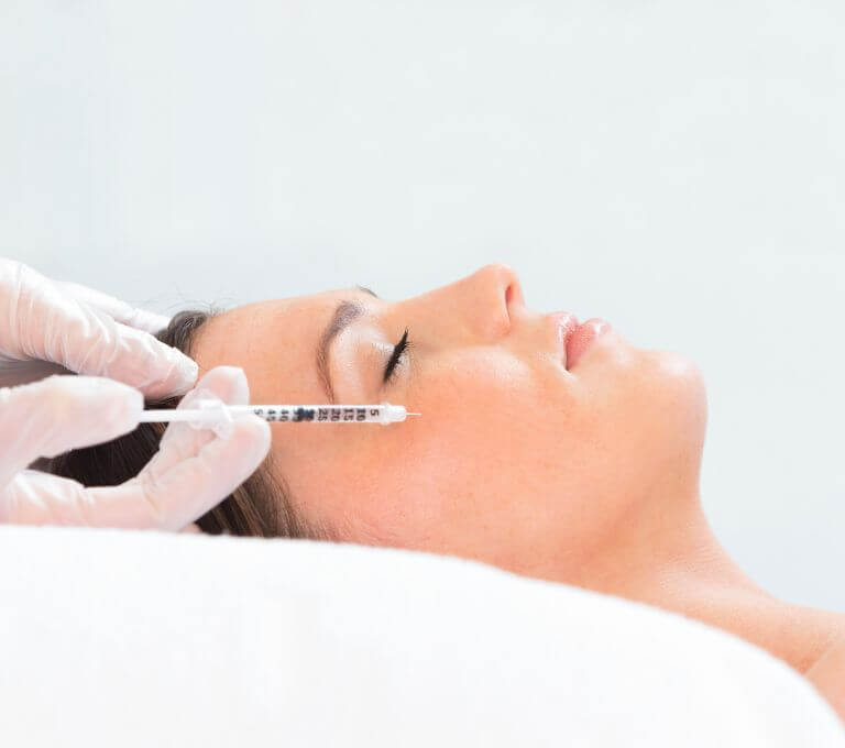 Woman getting a facial injection at Emma J Aesthetics